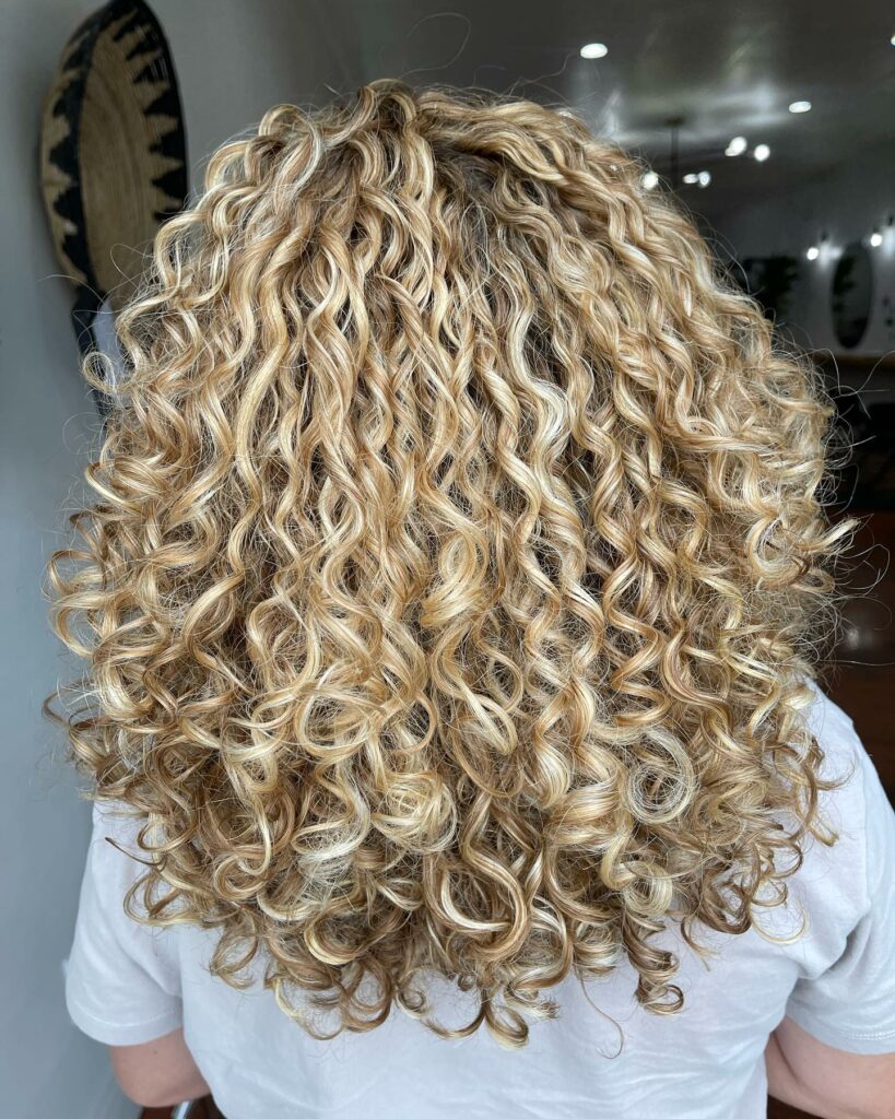 Blonde Balayage On Dark Curly Hair