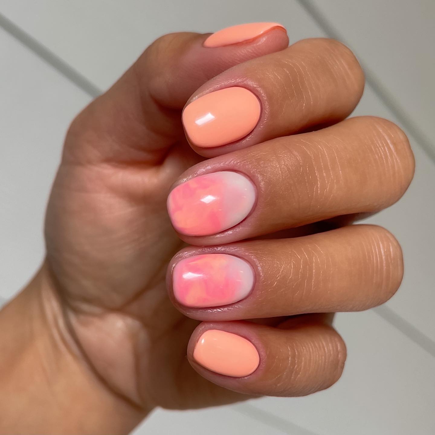 pink and orange marble nails